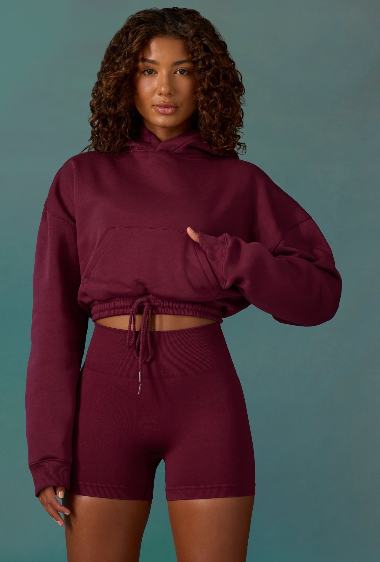 Progess Cropped Drawstring Hooded Sweatshirt in Plum Oh Polly