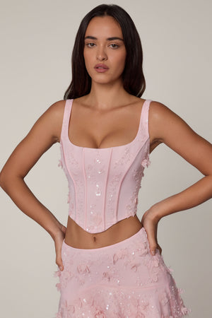 Oh Polly's Roberta wearing the Letitia Corset Top in Ballet Pink Embellished fabric perfect for romantic date nights