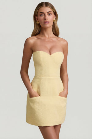 Oh Polly's Freya Tidy wearing the Talina Mini Dress in Pastel Yellow Tweed fabric perfect for birthday celebrations