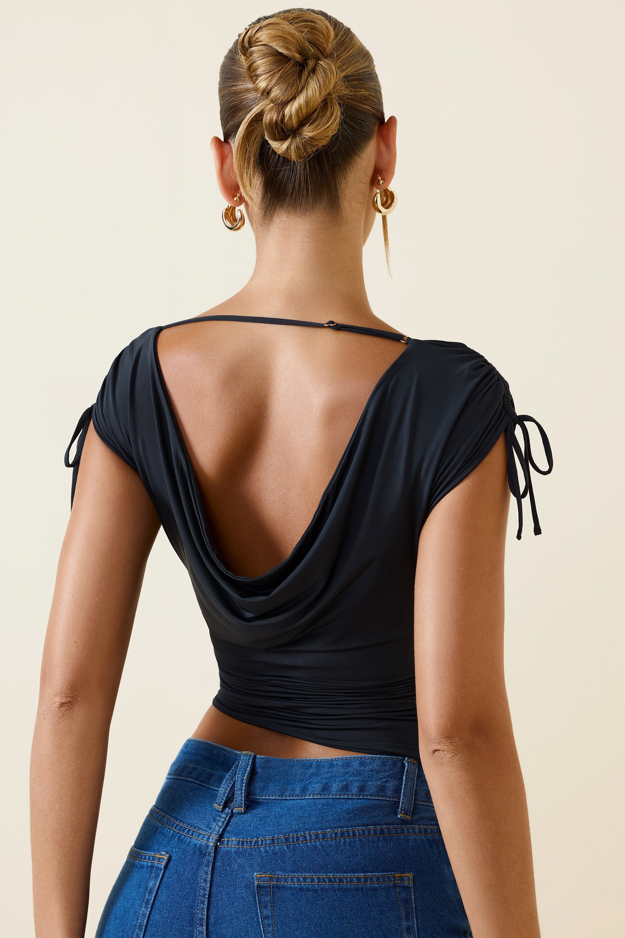 Asymmetric Ruched Cowl-Back Crop Top in Black