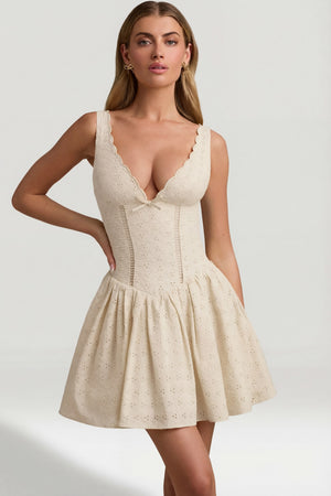 Oh Polly's Freya Tidy wearing the Sabina Mini Dress in Ivory Woven fabric perfect for cocktail hour gatherings