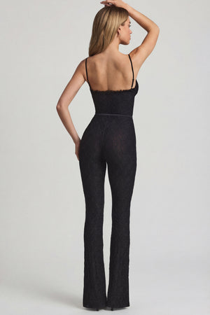 Oh Polly's Freya Tidy wearing the Arlena Regular Jumpsuit in Black Stretch Lace fabric perfect for a night out