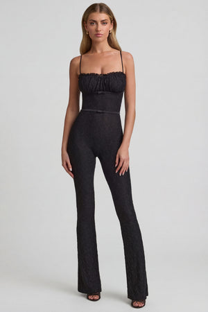 Oh Polly's Freya Tidy wearing the Arlena Regular Jumpsuit in Black Stretch Lace fabric perfect for special occasions