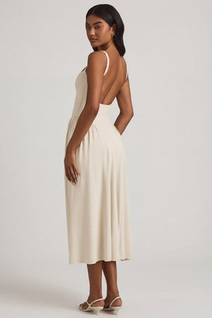 Oh Polly's Yarelis wearing the Aireen Midaxi Dress in Ivory Modal fabric perfect for elegant evening events