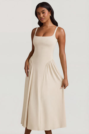 Oh Polly's Yarelis wearing the Aireen Midaxi Dress in Ivory Modal fabric perfect for cocktail hour soirées