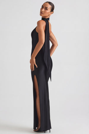 Oh Polly's Priscilla wearing the Sheril Gown Length Dress in Black Satin Jersey fabric perfect for holiday celebrations