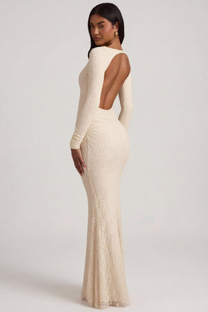 Oh Polly's Yarelis wearing the Tarini Maxi Dress in Ivory Stretch Lace fabric perfect for bridal showers