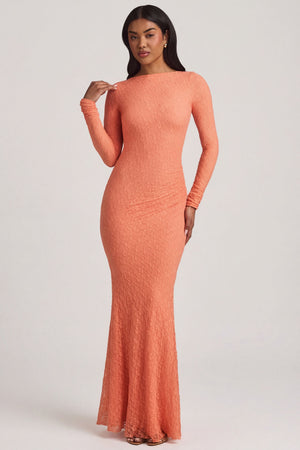 Oh Polly's Yarelis wearing the Tarini Maxi Dress in Peach Stretch Lace fabric perfect for destination weddings