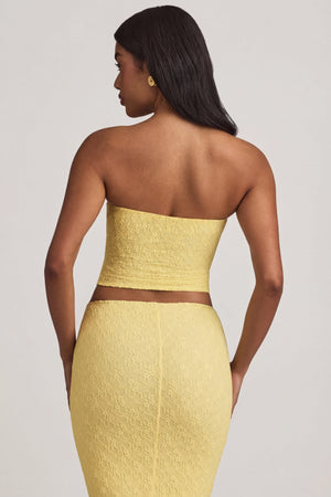 Oh Polly's Yarelis wearing the Tamia Full Top in Pastel Yellow Stretch Lace fabric perfect for summer brunches
