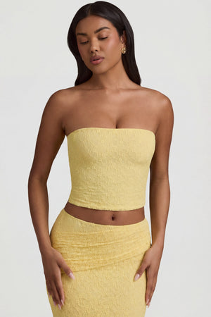 Oh Polly's Yarelis wearing the Tamia Full Top in Pastel Yellow Stretch Lace fabric perfect for rooftop gatherings