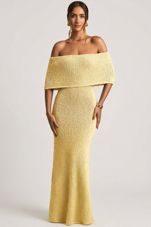 Oh Polly model Priscilla wearing the Naia Maxi Dress in Yellow Boucle Knit fabric perfect for summer garden parties