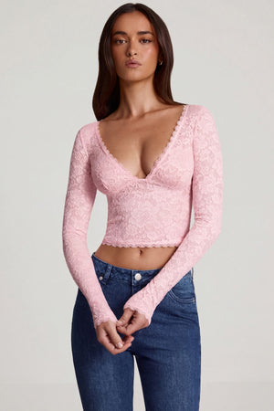 Oh Polly's Roberta wearing the Lioren Full Top in Pink Stretch Lace fabric perfect for holiday getaways