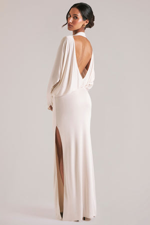 Oh Polly model Yasmin wearing the Lani Maxi Dress in Ivory Soft Jersey fabric perfect for rooftop cocktails