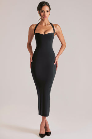 Oh Polly model Yasmin wearing the Landen Midi Dress in Black Modal fabric perfect for date night