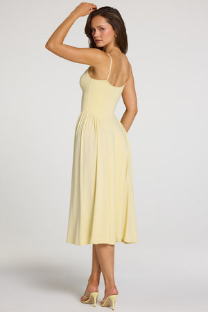 Oh Polly model Georgia wearing the Livia Midaxi Dress in Pastel Yellow Modal fabric perfect for birthday lunches