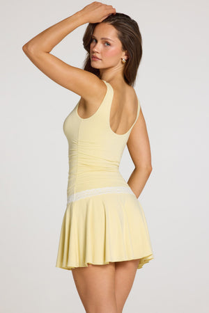 Oh Polly model Georgia wearing the Maia Mini Dress in Pastel Yellow Modal fabric perfect for rooftop gatherings