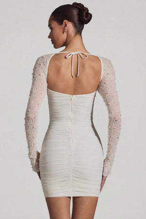 Oh Polly's Priscilla wearing the St Germain Mini Dress in White Embellished, Mesh fabric perfect for summer garden parties