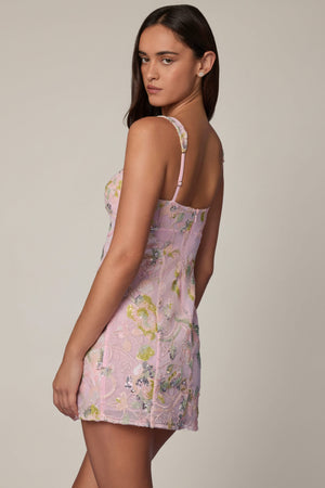 Oh Polly's Roberta wearing the Adia Mini Dress in Ballet Pink Sequin, Chiffon fabric perfect for a holiday event