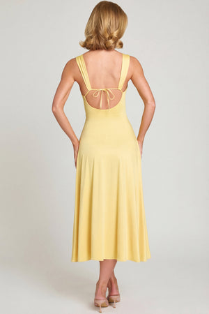 Oh Polly's Sienna wearing the Thandie Midaxi Dress in Pastel Yellow Slinky fabric perfect for summer garden parties