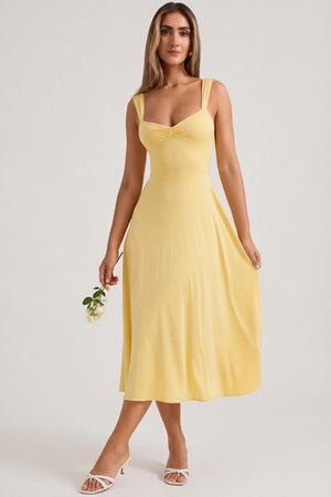 Oh Polly's Sienna wearing the Thandie Midaxi Dress in Pastel Yellow Slinky fabric perfect for birthday celebrations