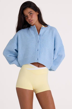 Bo+Tee model Nikki wearing the Christmas Knits Cardigan in Powder Blue Knitwear fabric perfect for holiday family gatherings