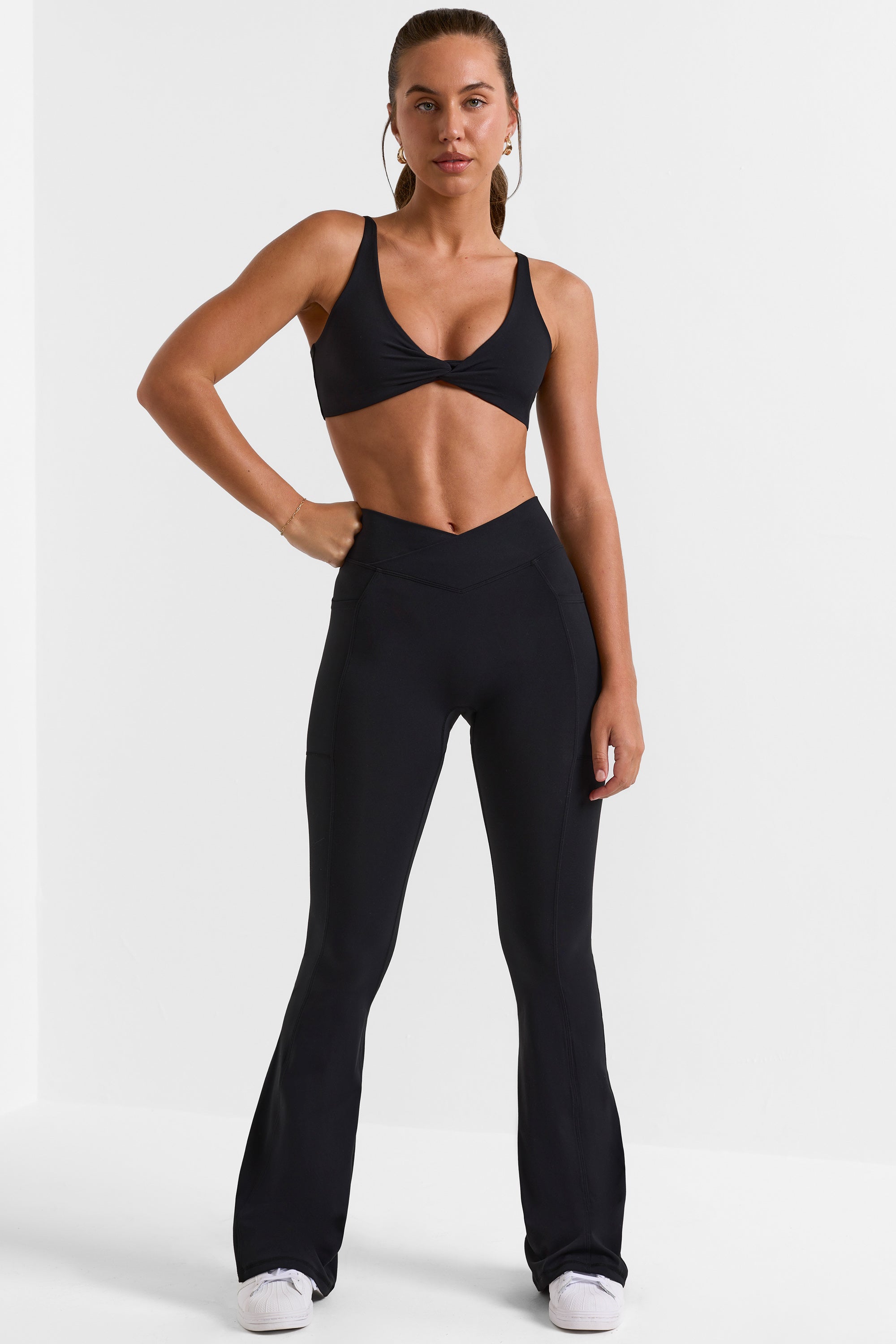 Cross Waistband Flare Pocket Leggings in Black