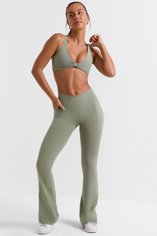 Petite Cross Waistband Flare Pocket Leggings in Bamboo Green