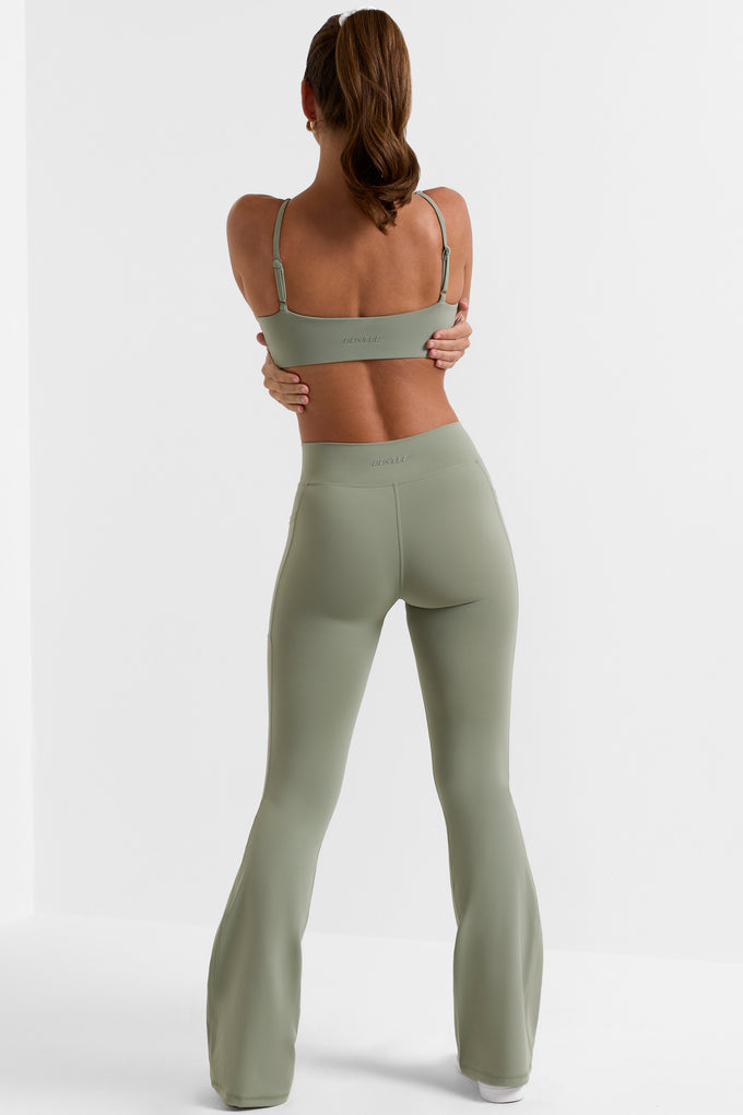 Cross Waistband Flare Pocket Leggings in Bamboo Green