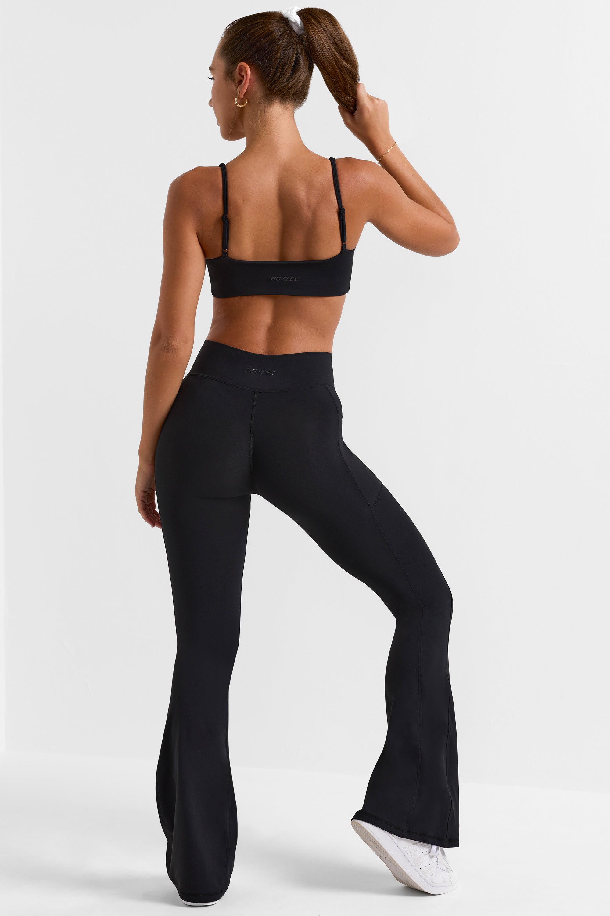 Cross Waistband Flare Pocket Leggings in Black