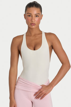 Bo+Tee model Hayley wearing the Rebloom Bodysuit in Ivory Ribbed Modal fabric perfect for casual date nights