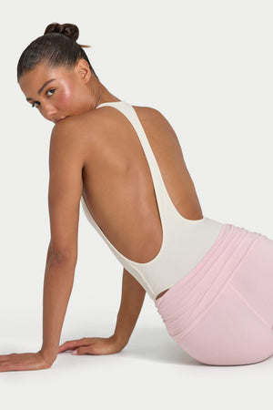 Bo+Tee model Hayley wearing the Rebloom Bodysuit in Ivory Ribbed Modal fabric perfect for summer garden parties