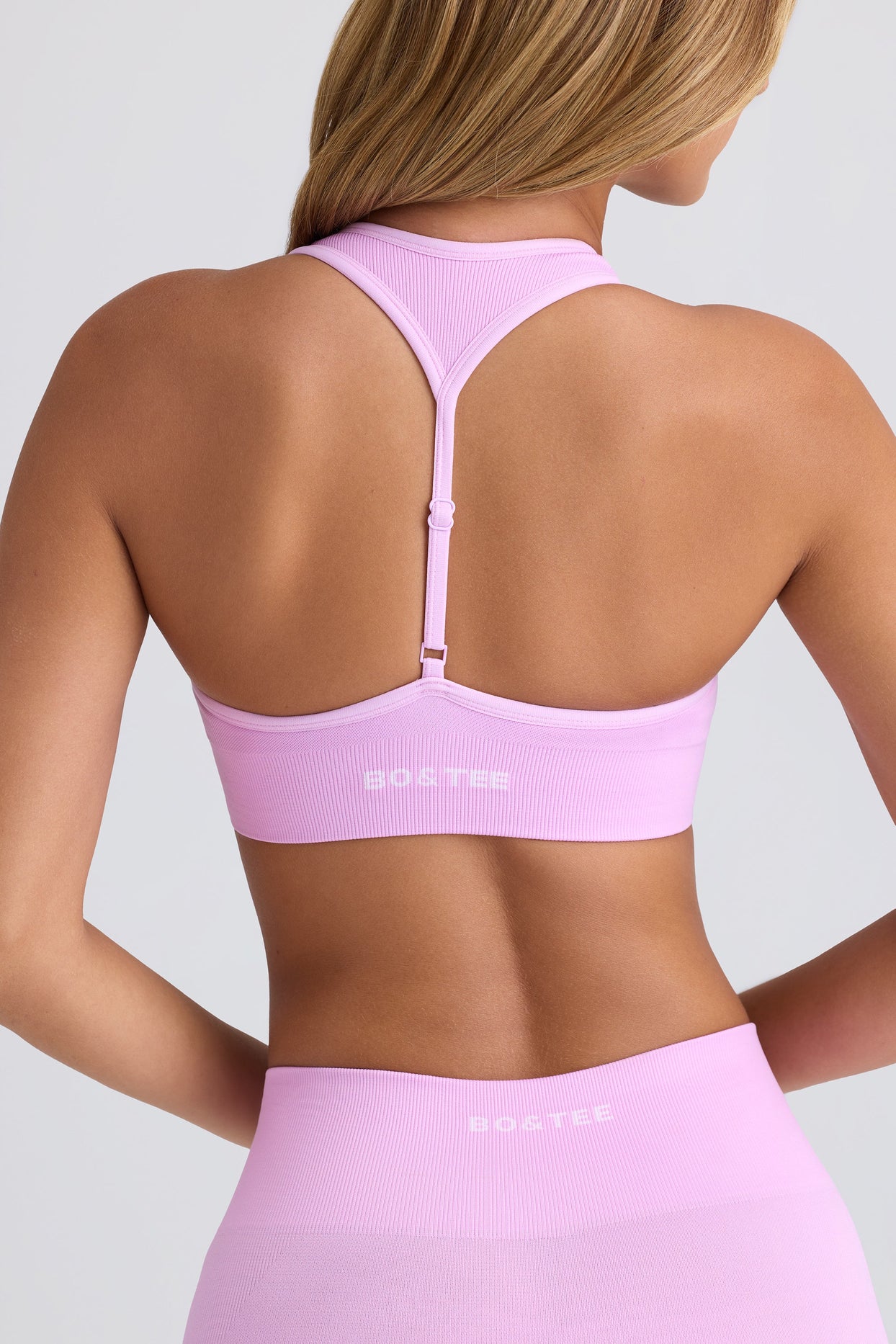 Super Sculpt Seamless T-Back Sports Bra in Violet Pink