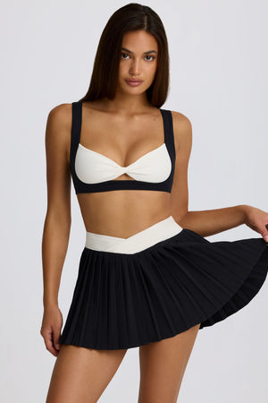 Soft Active Crossover Pleated Mini Skort in Black