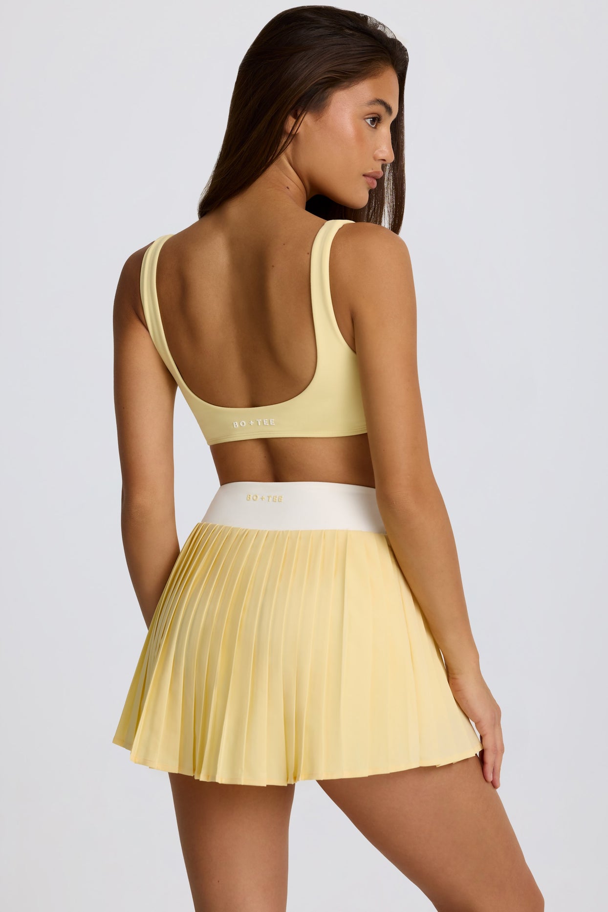 Soft Active Crossover Pleated Mini Skort in Lemon - 2