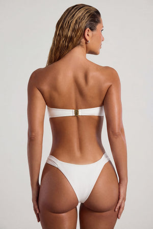 Oh Polly Swim's Sierra Skye wearing the Maui Bikini Bottoms in Ivory fabric perfect for poolside lounging