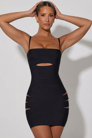 Oh Polly's Sierra Skye wearing the Aoka Mini Dress in Black Bandage fabric perfect for evening dinners