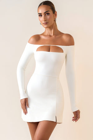 Oh Polly's Priscilla wearing the Amaris Mini Dress in White Modal fabric perfect for holiday getaways