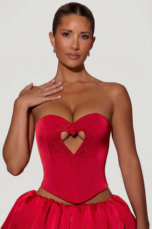 Oh Polly's Sierra Skye wearing the Amora Corset Top in Red Satin fabric perfect for a special anniversary evening