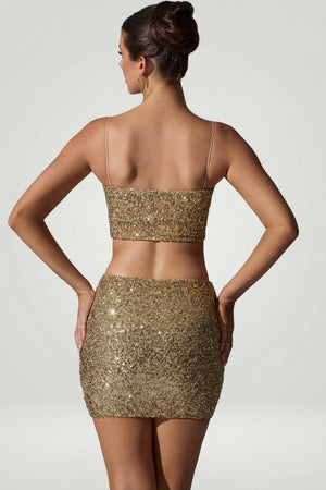 Oh Polly's Anna wearing the Aubrey Mini Skirt in Gold Micro Sequin fabric perfect for a night out