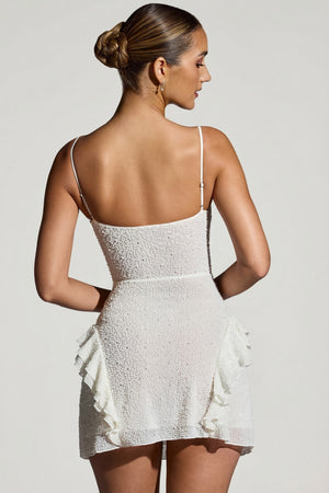 Oh Polly's Priscilla wearing the Domblans Mini Dress in White Embellished fabric perfect for summer parties