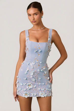 Oh Polly's Anna wearing the Briar Mini Dress in Sky Blue Embellished fabric perfect for summer parties