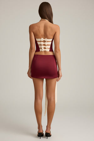 Oh Polly's Anna wearing the Carola Mini Skirt in Wine Red Satin, Taffeta fabric perfect for a night out dancing
