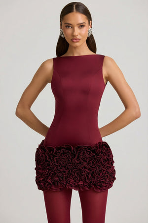 Oh Polly's Anna wearing the Florrie Mini Dress in Wine Red Satin fabric perfect for a festive celebration