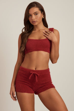 Oh Polly's Hayley wearing the Gulisa Mini Shorts in Ruby Red fabric perfect for date night style