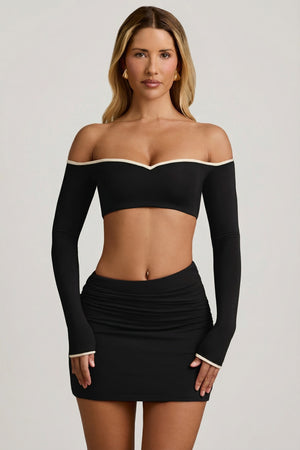 Oh Polly's Leidy wearing the Irie Crop Top in Black Modal fabric perfect for rooftop events