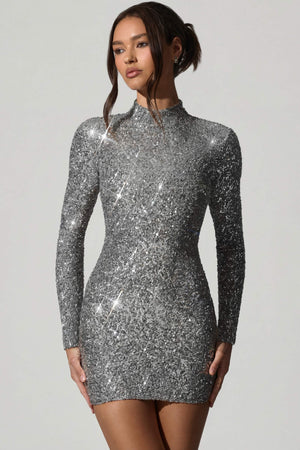 Oh Polly's Anna wearing the Kavita Mini Dress in Silver Micro Sequin fabric perfect for a night out