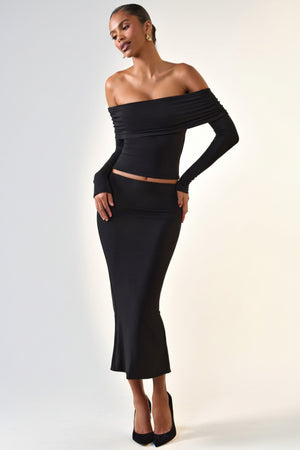 Oh Polly's Sarah wearing the Livvy Midi Skirt in Black Modal fabric perfect for a night out