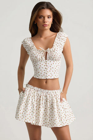 Oh Polly's Sophia wearing the Maira Mini Skirt in White Ditsy Rose Print Cotton fabric perfect for summer garden parties