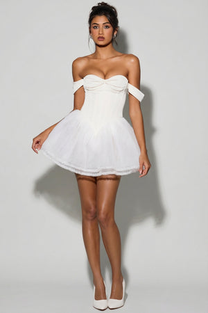 Oh Polly's Meeya wearing the Meredith Mini Dress in White Tulle fabric perfect for summer garden parties
