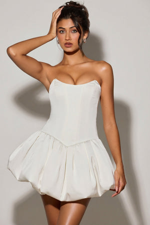 Oh Polly's Meeya wearing the Minerva Mini Dress in White Satin fabric perfect for engagement photo shoots